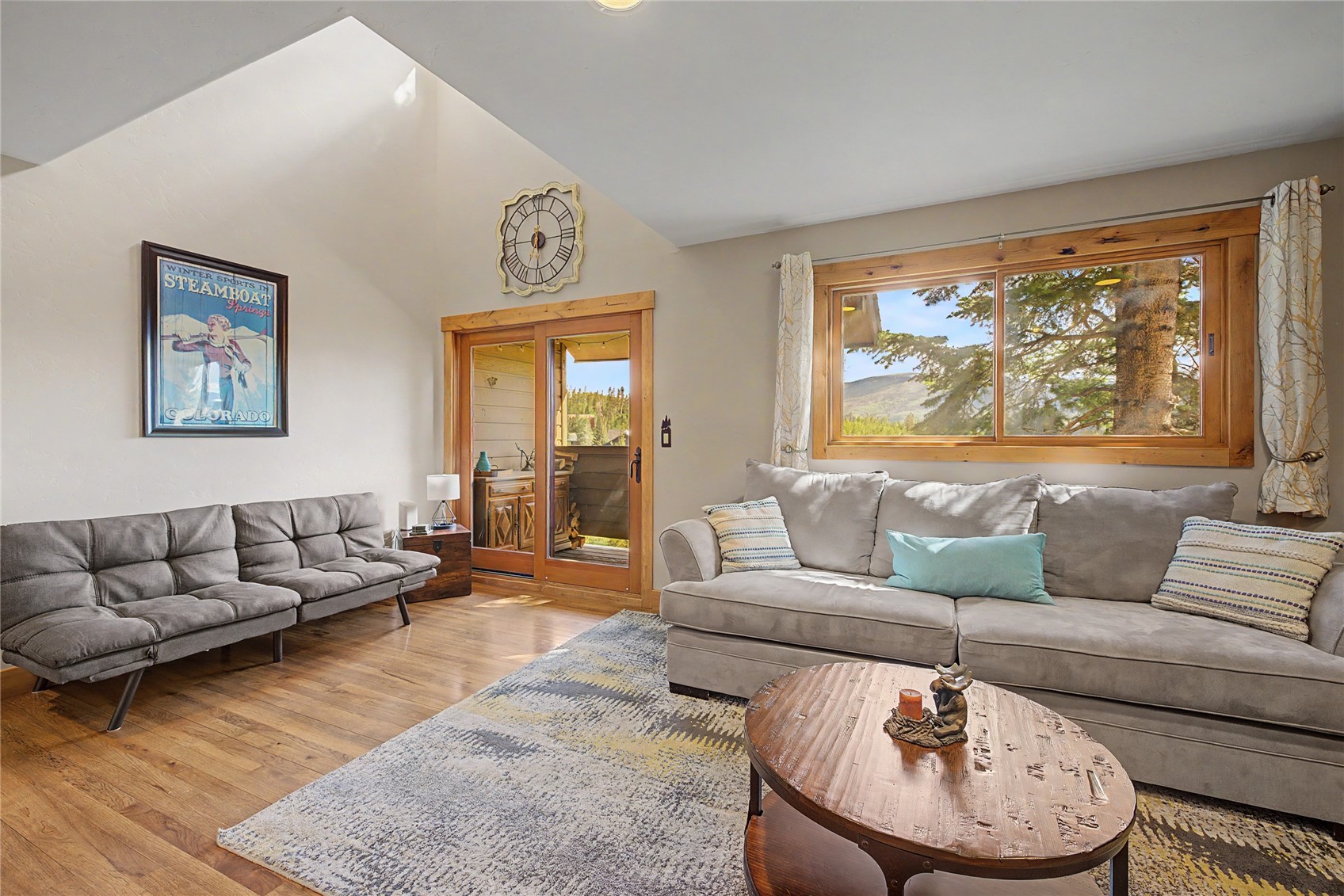 6726 Ryan Gulch Road, Unit 6726 Wildernest, CO 80498 - Photo 26 of 39 a living room with furniture and a large window