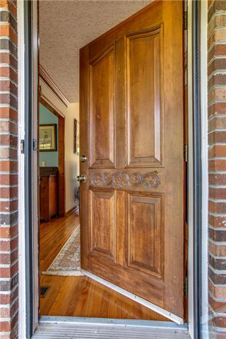 6289 Meeks Road Franklin, TN 37064 - Photo 4 of 20 Unique front door has a newer storm door which allows for lots of natural light.
