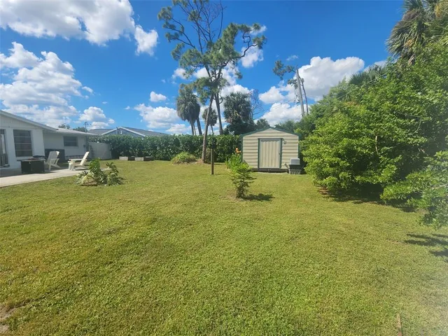 a view of a house with a big yard