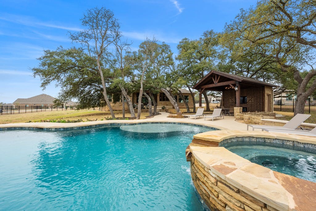 709 July Johnson Drive Austin, TX 78737 - Photo 1 of 1 a view of a swimming pool with lounge chair