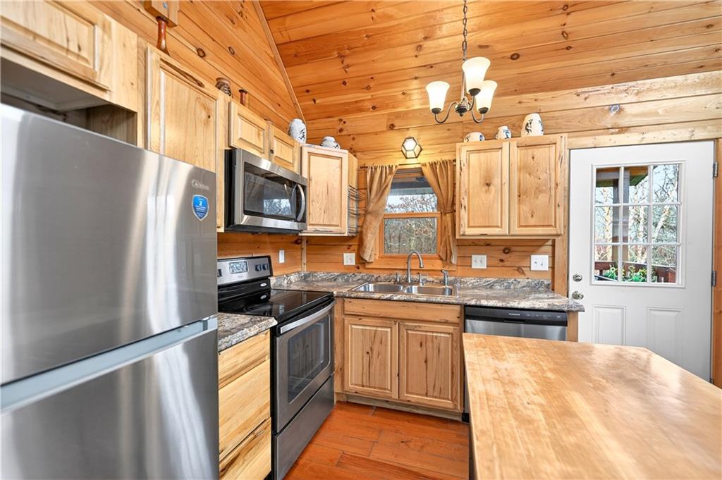 64 Memorial Drive Perryopolis, PA 15473 - Photo 13 of 44 a kitchen with a sink stove and microwave
