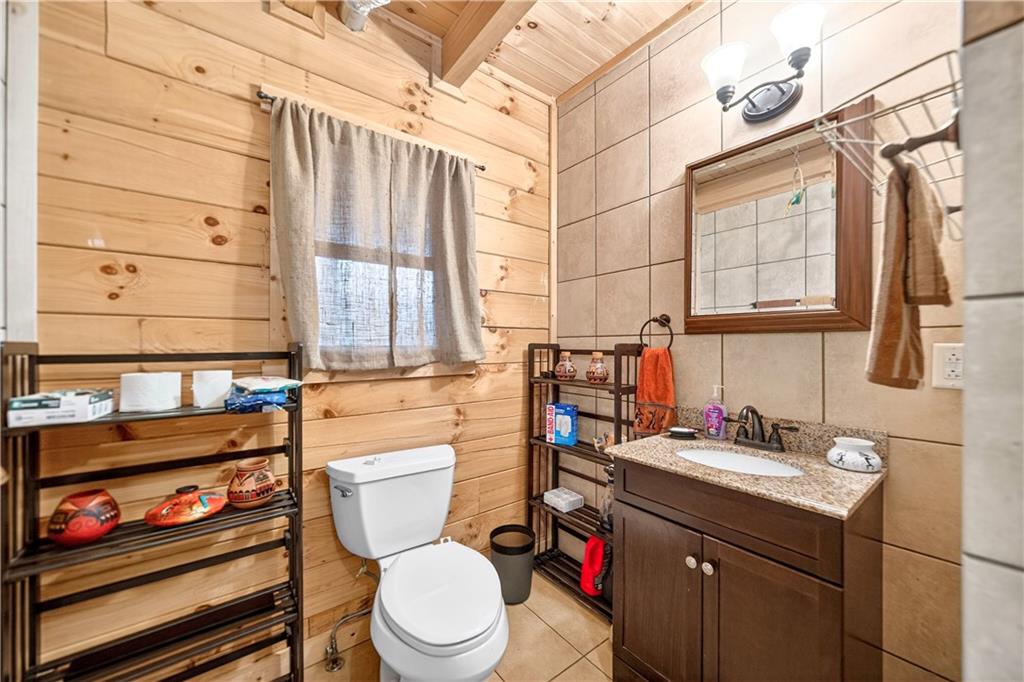 64 Memorial Drive Perryopolis, PA 15473 - Photo 15 of 44 a bathroom with a toilet sink and mirror