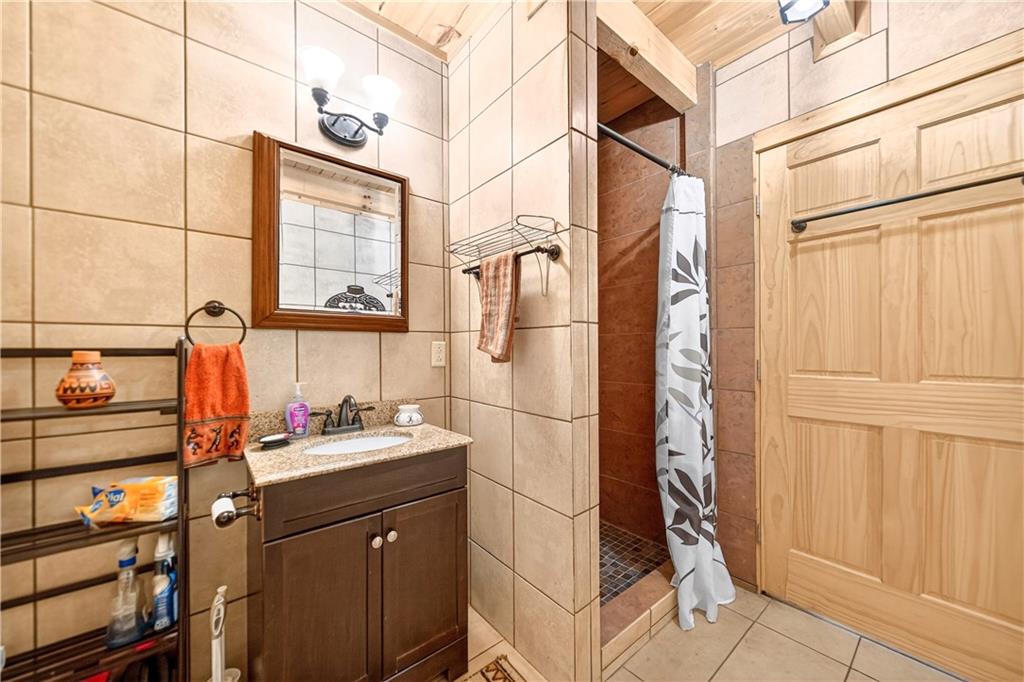 64 Memorial Drive Perryopolis, PA 15473 - Photo 16 of 44 a bathroom with a sink and mirror