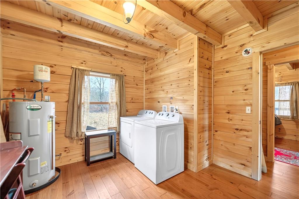 64 Memorial Drive Perryopolis, PA 15473 - Photo 21 of 44 a view of washer and dryer with wooden floor
