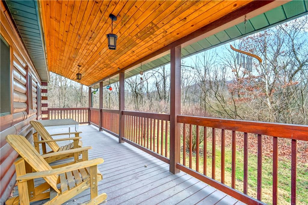64 Memorial Drive Perryopolis, PA 15473 - Photo 30 of 44 a view of balcony with wooden floor and seating space