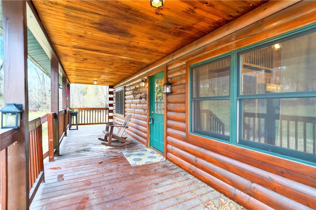 64 Memorial Drive Perryopolis, PA 15473 - Photo 33 of 44 a view of porch with wooden floor and iron stairs