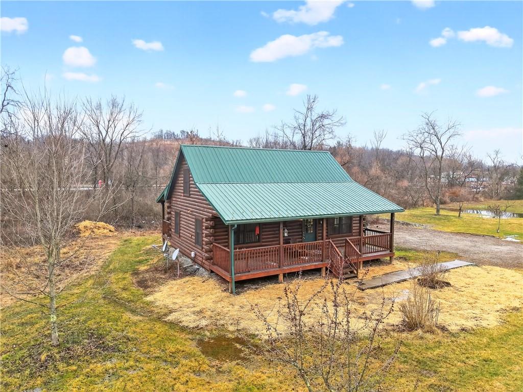 64 Memorial Drive Perryopolis, PA 15473 - Photo 44 of 44 a small pool with a table and chairs