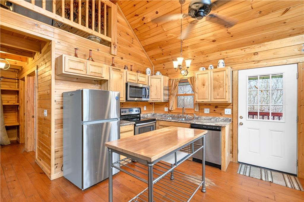 64 Memorial Drive Perryopolis, PA 15473 - Photo 9 of 44 a kitchen with stainless steel appliances a stove a refrigerator and a refrigerator