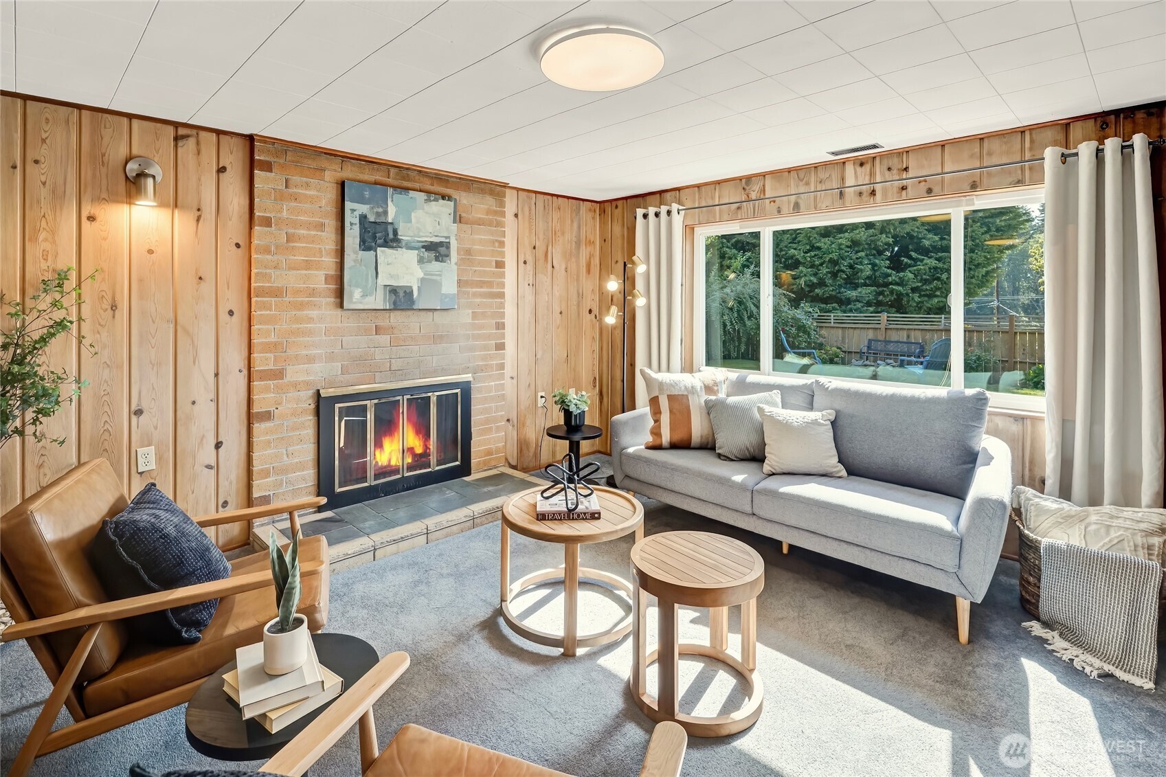 7571 45th Avenue Southwest Seattle, WA 98136 - Photo 27 of 40 a living room with furniture and a fireplace
