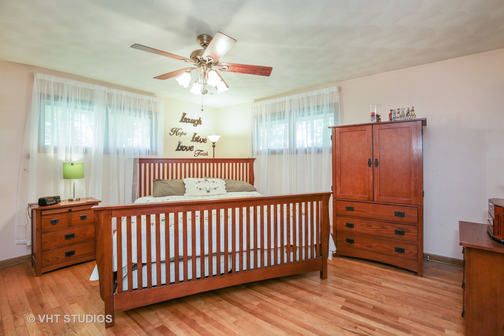 707 Hickory Road Woodstock, IL 60098 - Photo 9 of 16 a bedroom with a bed and a window