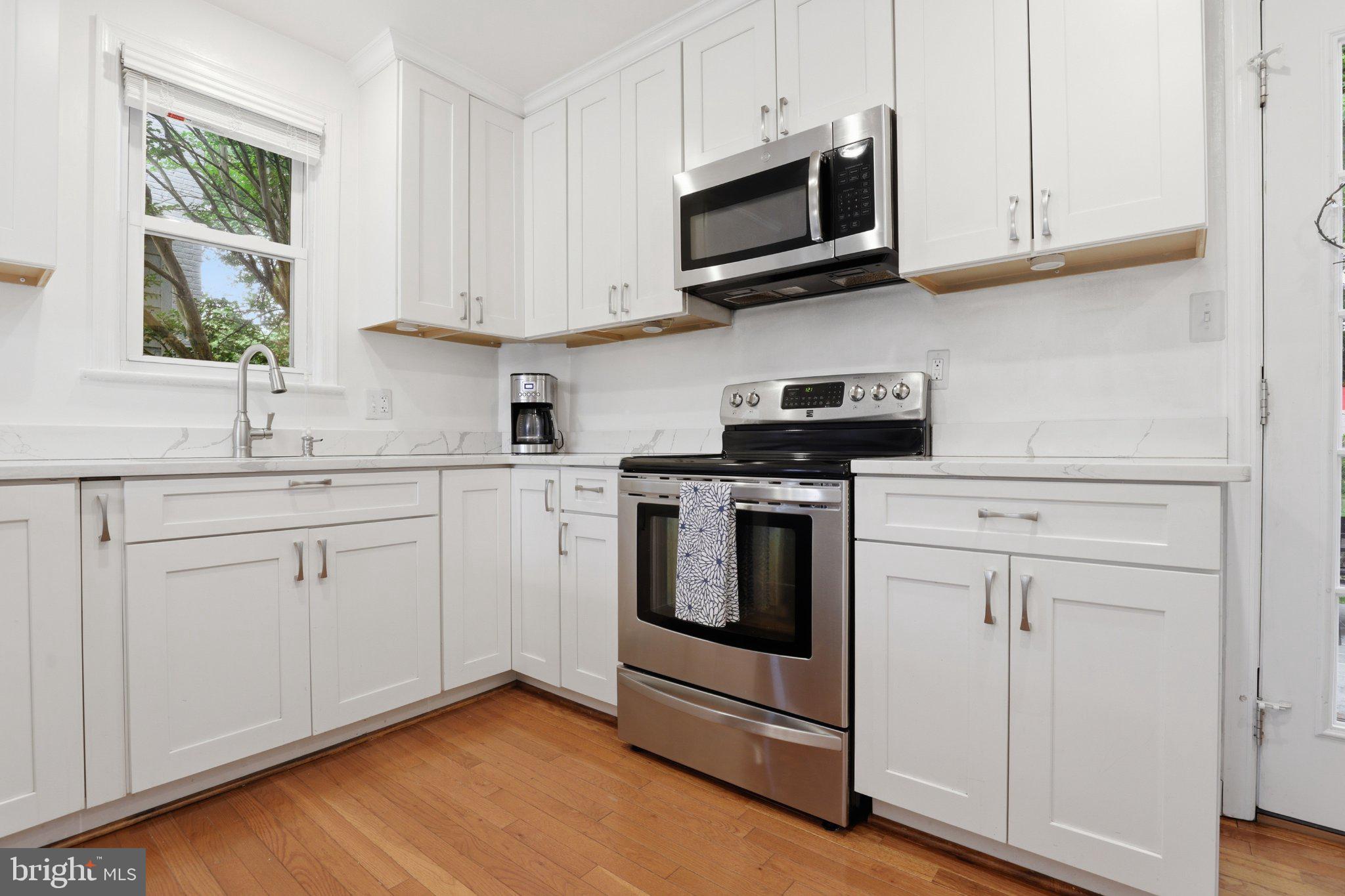 10032 Dallas Avenue Silver Spring, MD 20901 - Photo 5 of 38 Modern kitchen with sleek finishes.