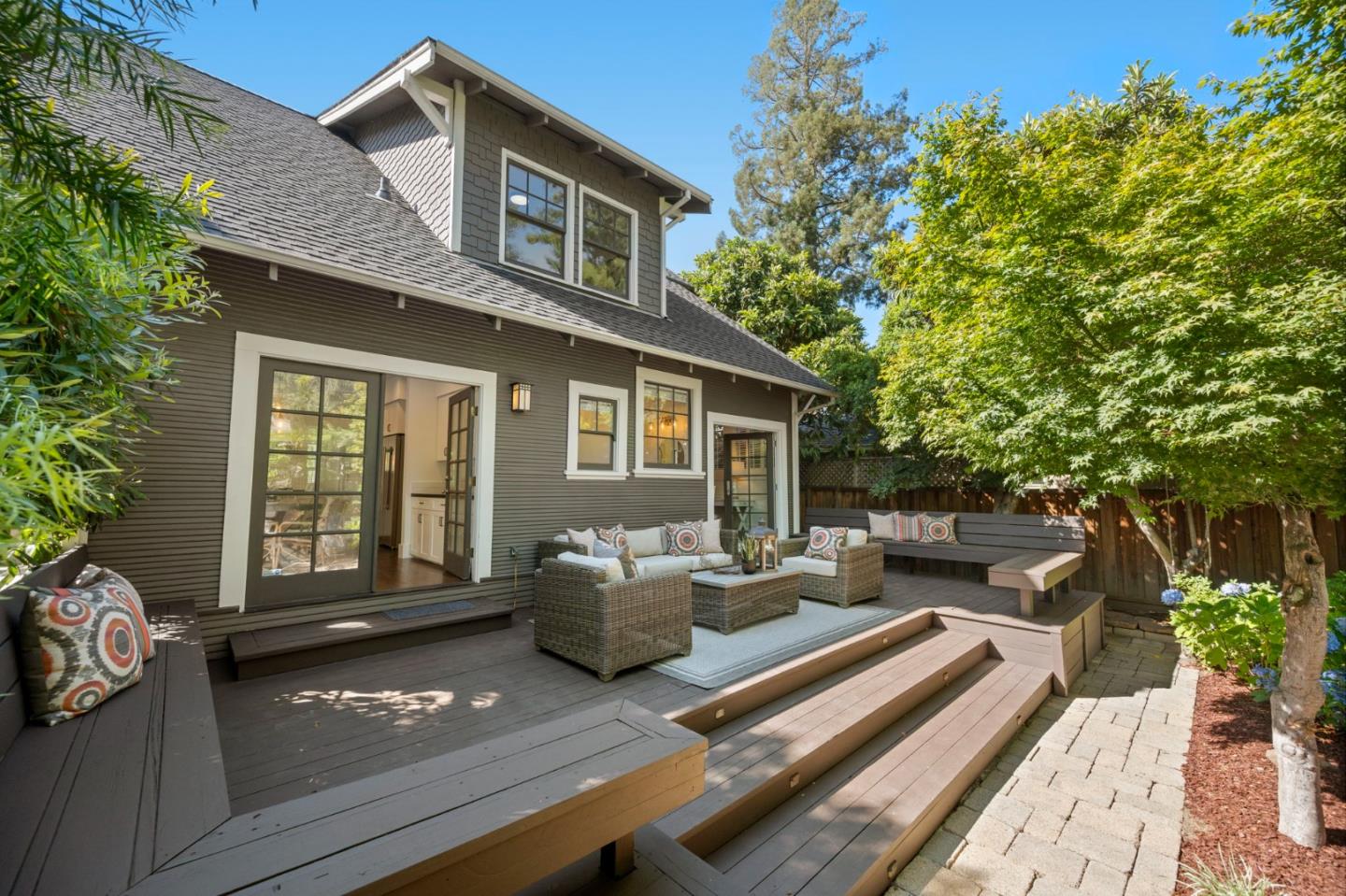 445 Arlington Road Redwood City, CA 94062 - Photo 27 of 50 a view of a patio with couches table and chairs and potted plants
