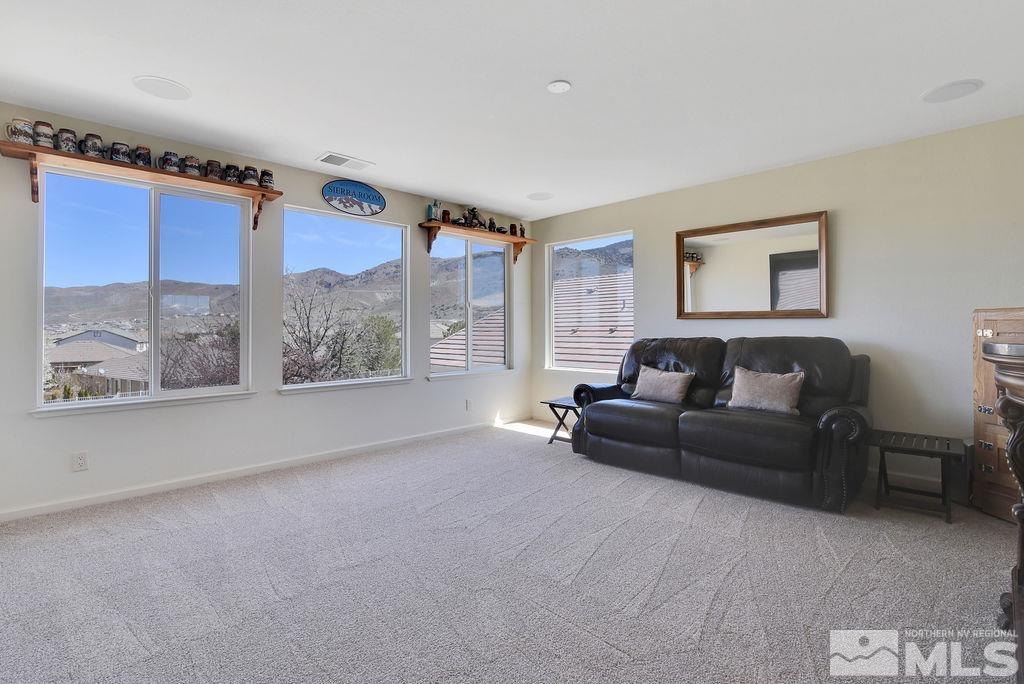 10778 Misty Meadows Drive Reno, NV 89521 - Photo 23 of 40 a living room with furniture and a large window