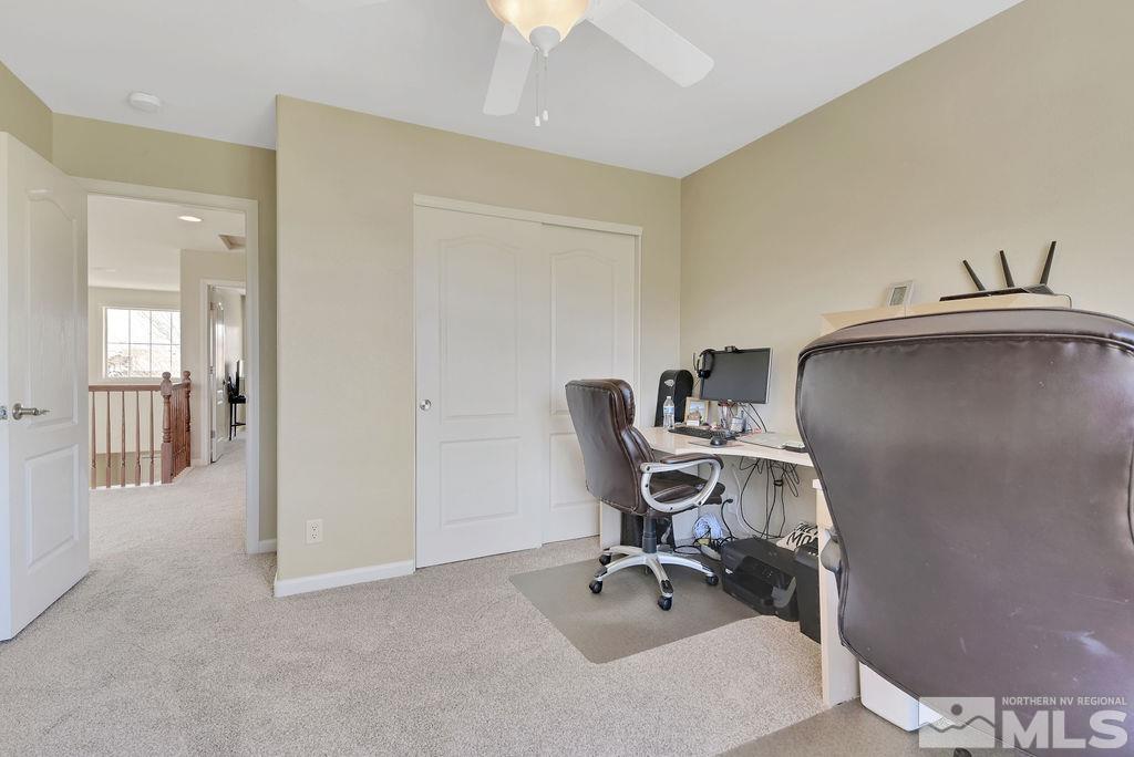 10778 Misty Meadows Drive Reno, NV 89521 - Photo 25 of 40 a view of a workspace with furniture and a bathroom
