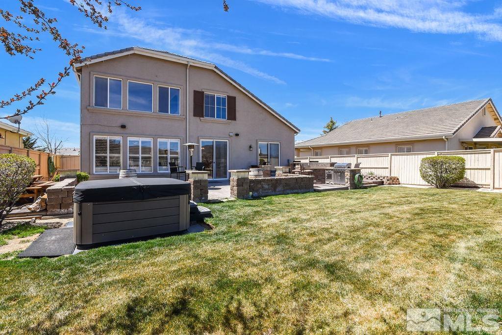 10778 Misty Meadows Drive Reno, NV 89521 - Photo 30 of 40 a front view of a house with a garden