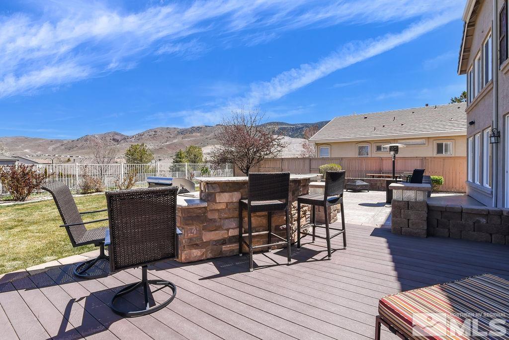 10778 Misty Meadows Drive Reno, NV 89521 - Photo 32 of 40 a view of a terrace from dinning room with furniture and wooden floor