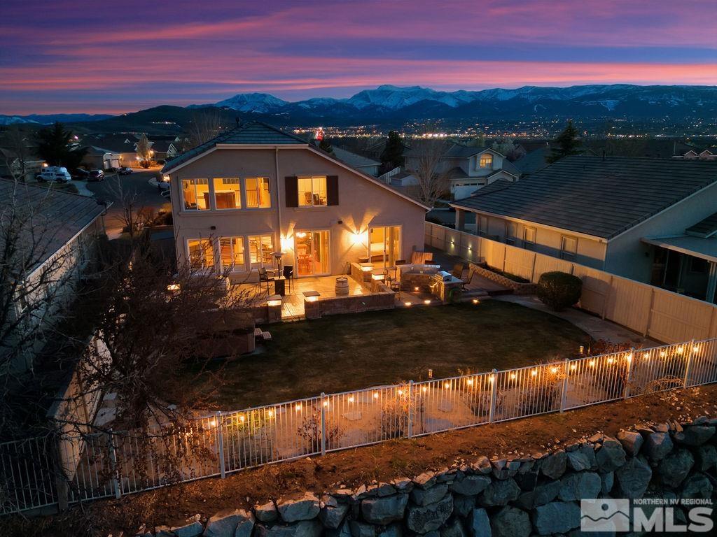 10778 Misty Meadows Drive Reno, NV 89521 - Photo 38 of 40 a view of a swimming pool with an outdoor space and seating