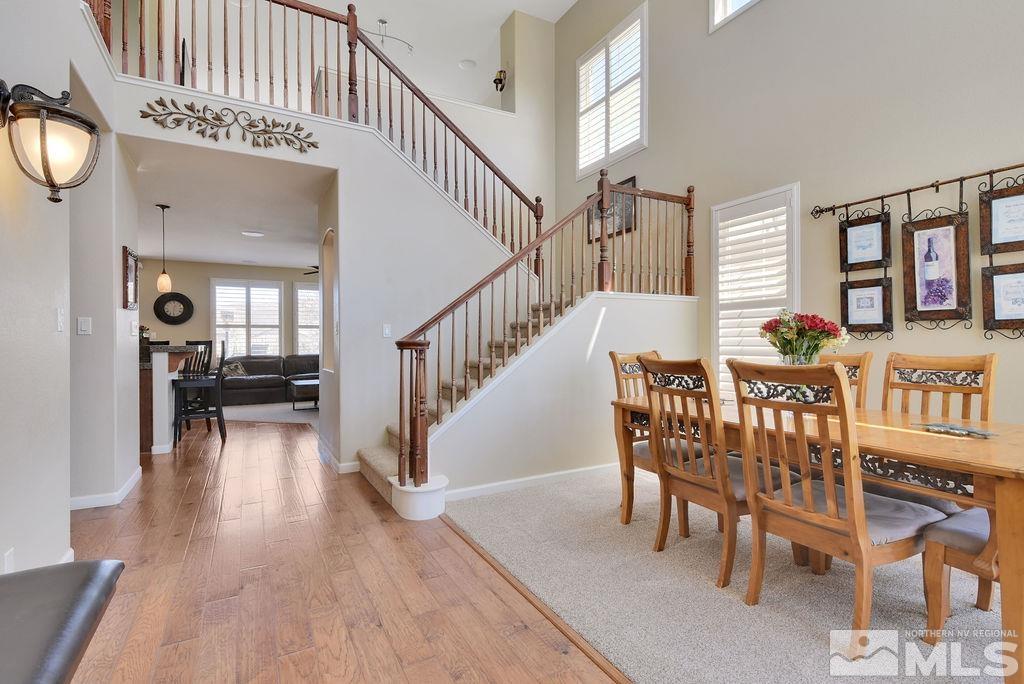 10778 Misty Meadows Drive Reno, NV 89521 - Photo 5 of 40 a dining room with furniture entryway and wooden floor
