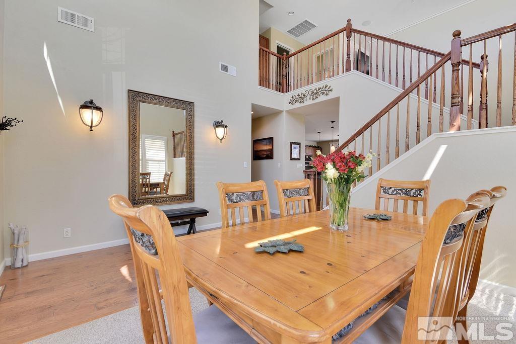 10778 Misty Meadows Drive Reno, NV 89521 - Photo 6 of 40 a view of a dining room with furniture and a chandelier