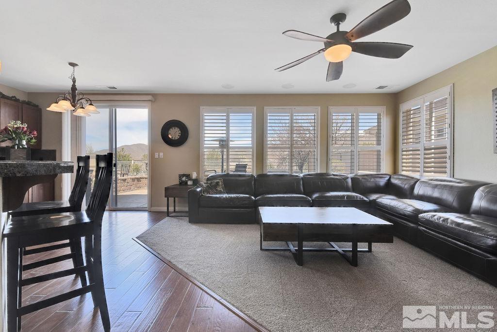 10778 Misty Meadows Drive Reno, NV 89521 - Photo 7 of 40 a living room with furniture and a large window
