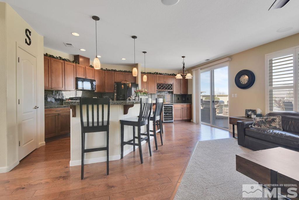 10778 Misty Meadows Drive Reno, NV 89521 - Photo 10 of 40 a large kitchen with a table and chairs