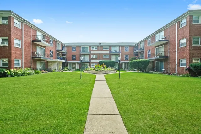 a view of a building with a yard