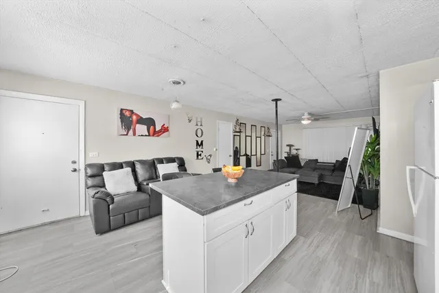 a view of living room and kitchen