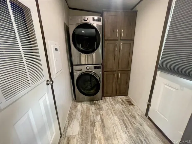 a view of a hallway with washer and dryer
