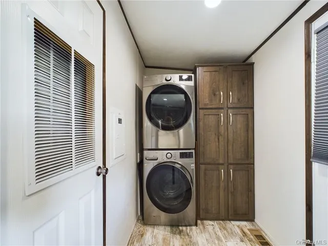 a view of a bedroom with washer and dryer