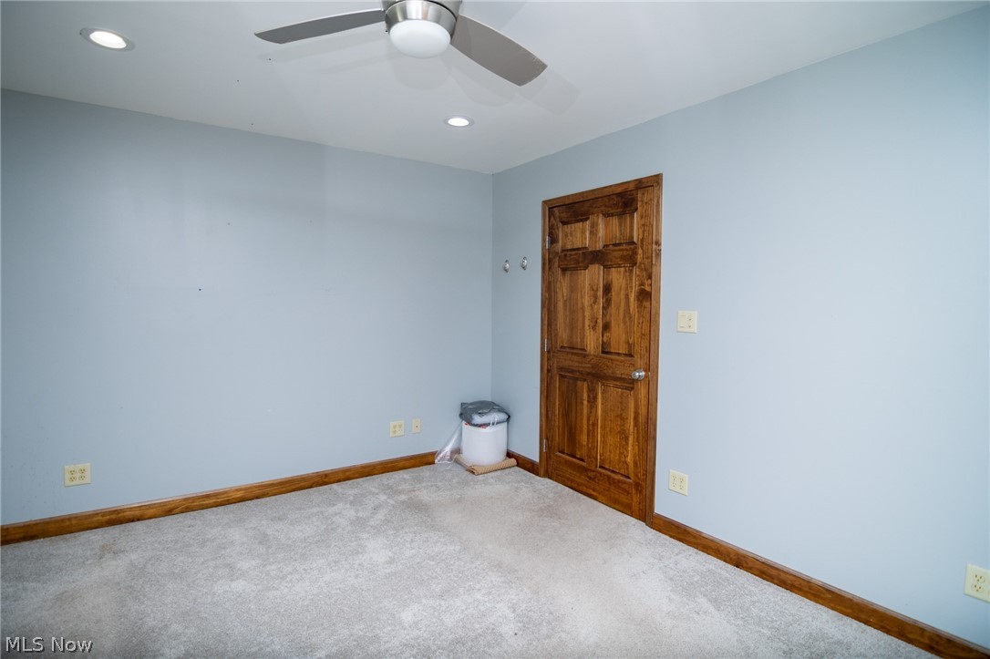 53341 Key Bellaire Road Bellaire, OH 43906 - Photo 19 of 48 Empty room with carpet, recessed lighting, and a ceiling fan