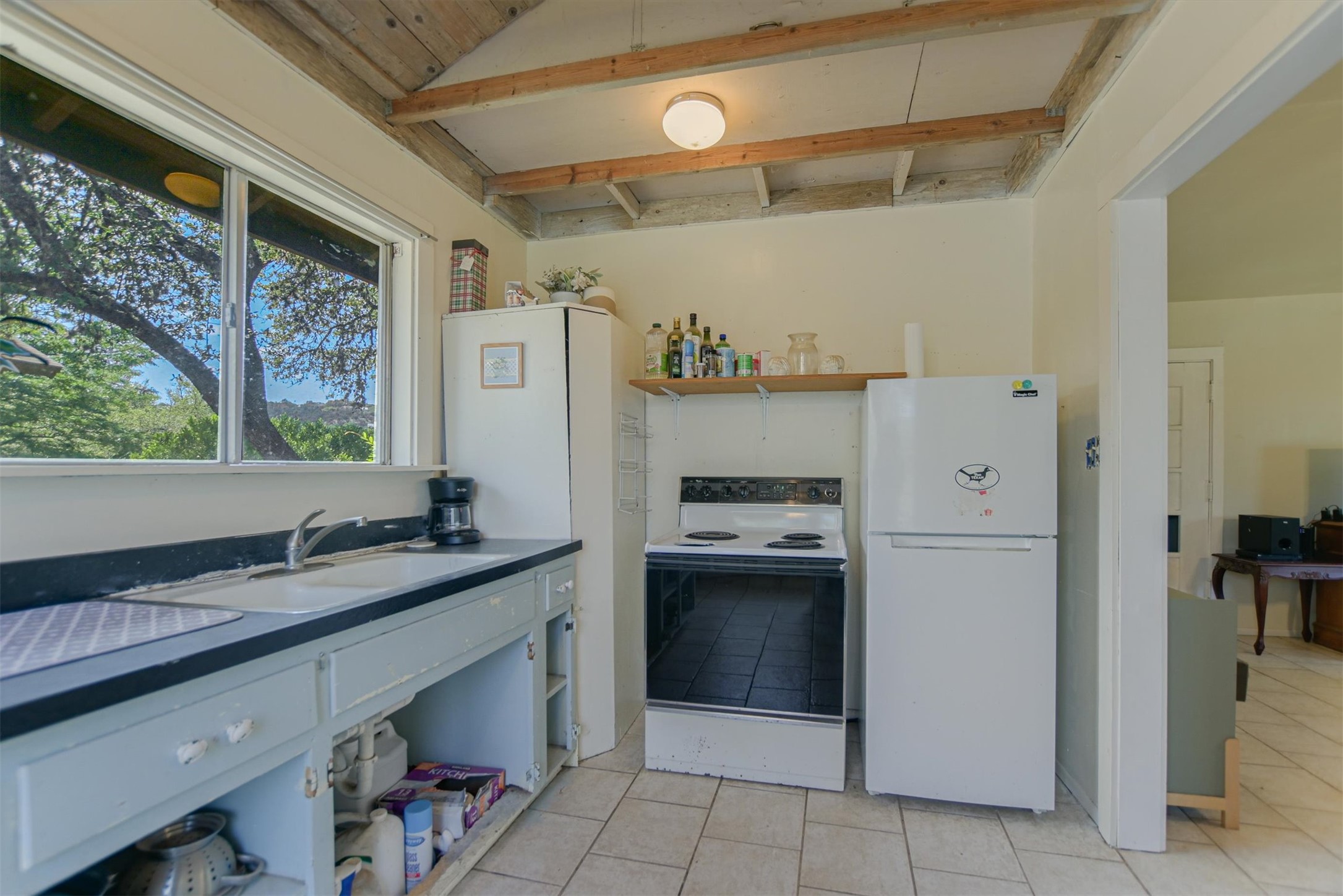 12711 Rr, Unit 12 Wimberley, TX 78676 - Photo 14 of 20 A full kitchen in the cottage ensures guests or tenants have everything they need for a long-term stay