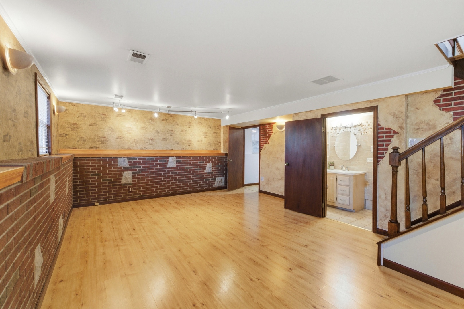 704 Springfield Drive Roselle, IL 60172 - Photo 16 of 28 a view of an empty room with wooden floor and a window
