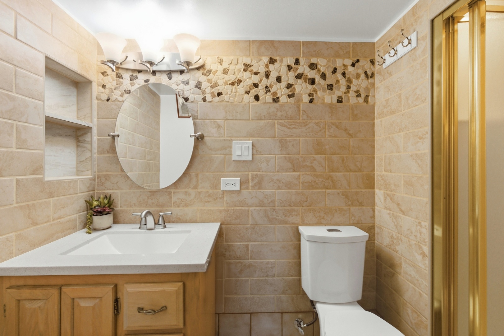 704 Springfield Drive Roselle, IL 60172 - Photo 18 of 28 a bathroom with a sink toilet and shower