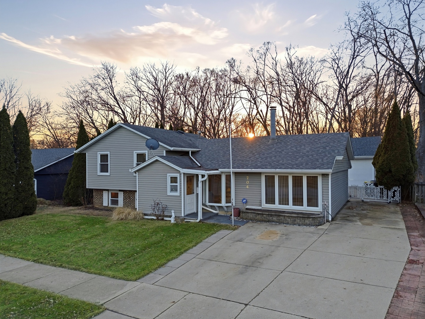 704 Springfield Drive Roselle, IL 60172 - Photo 2 of 28 front view of a house with a yard
