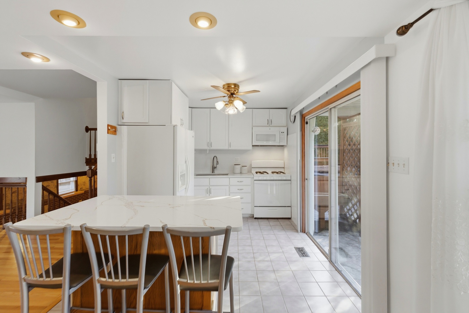 704 Springfield Drive Roselle, IL 60172 - Photo 6 of 28 a kitchen with a table and chairs