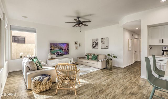 a living room with furniture and a large window