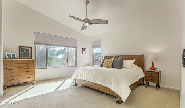 a spacious bathroom with double sink and a mirror view