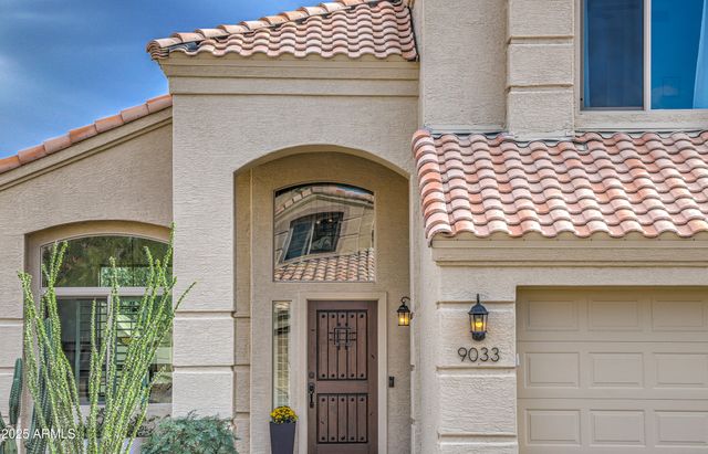 a front view of a house with a glass door