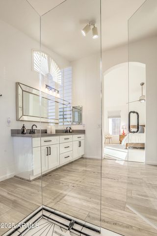 a living room with furniture and a baby crib