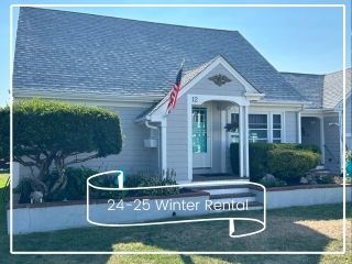 12 Waterman Street, Unit WINTER Mattapoisett, MA 02739 - Photo 1 of 19 a view of a house with a yard and sitting area