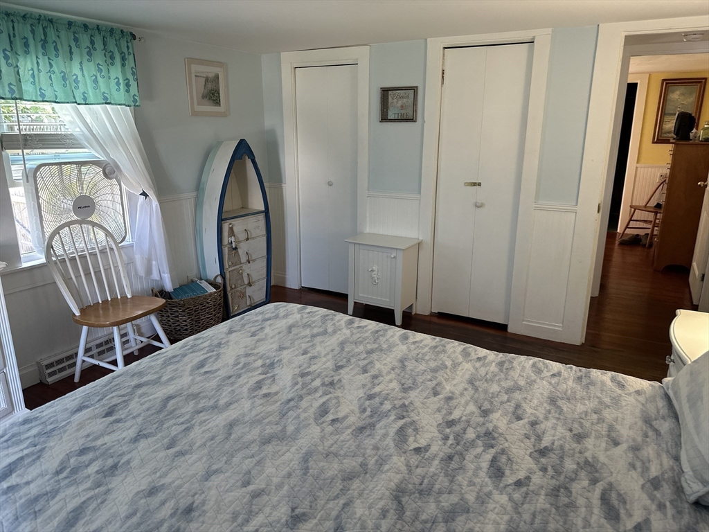 12 Waterman Street, Unit WINTER Mattapoisett, MA 02739 - Photo 15 of 19 a bedroom with a bed and a window