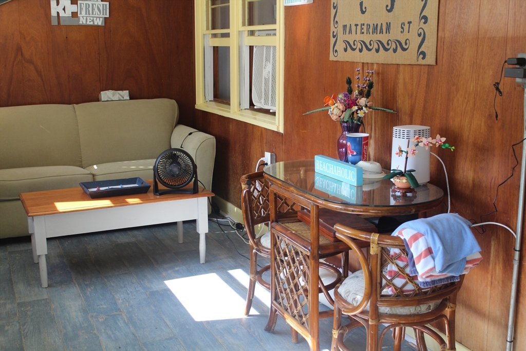12 Waterman Street, Unit WINTER Mattapoisett, MA 02739 - Photo 17 of 19 a view of a dining room with furniture and chandelier