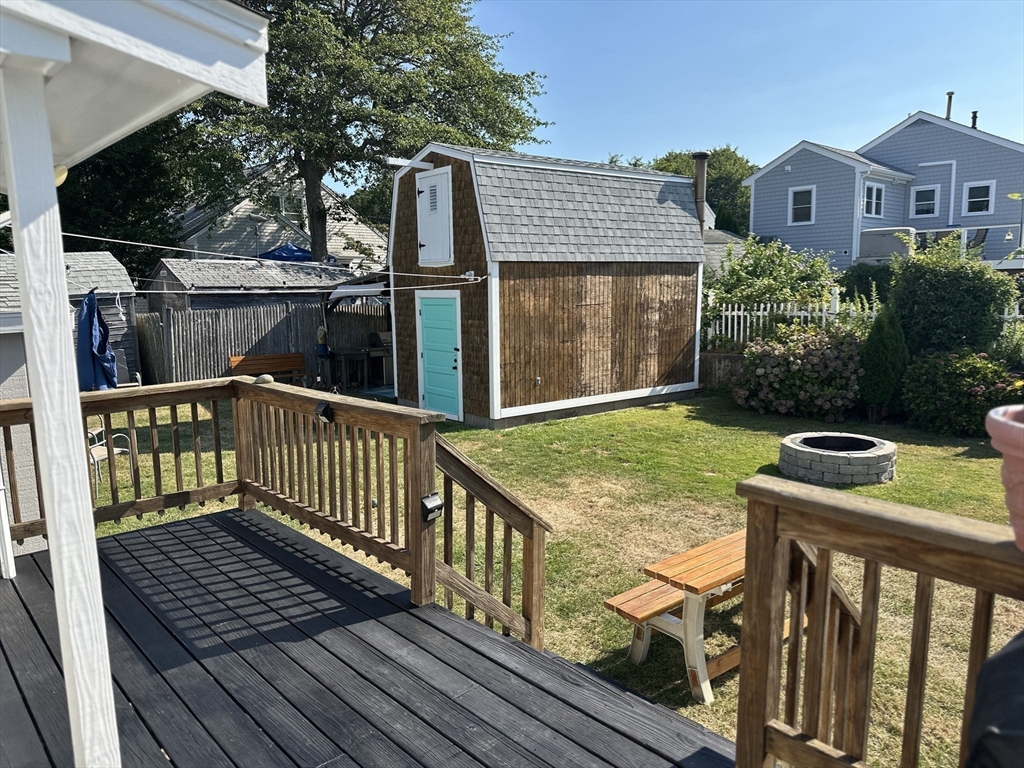 12 Waterman Street, Unit WINTER Mattapoisett, MA 02739 - Photo 18 of 19 a view of a wooden house with a yard