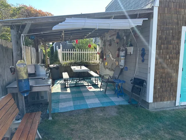 a view of living room filled with furniture and a chandelier