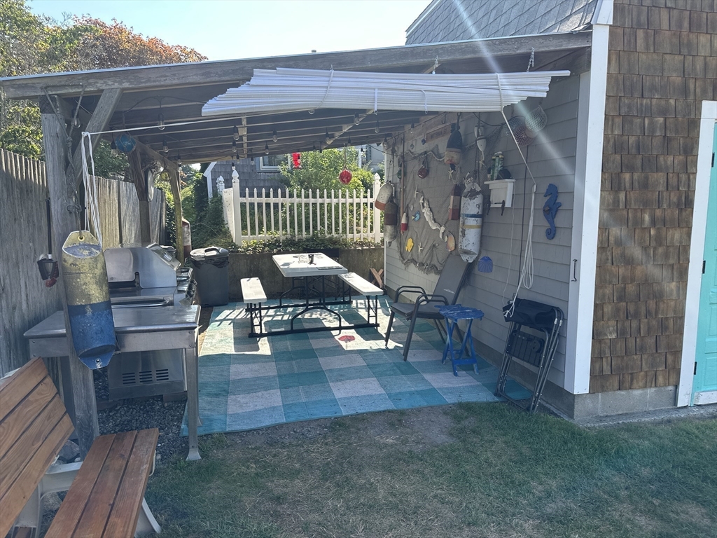 12 Waterman Street, Unit WINTER Mattapoisett, MA 02739 - Photo 19 of 19 a view of living room filled with furniture and a chandelier