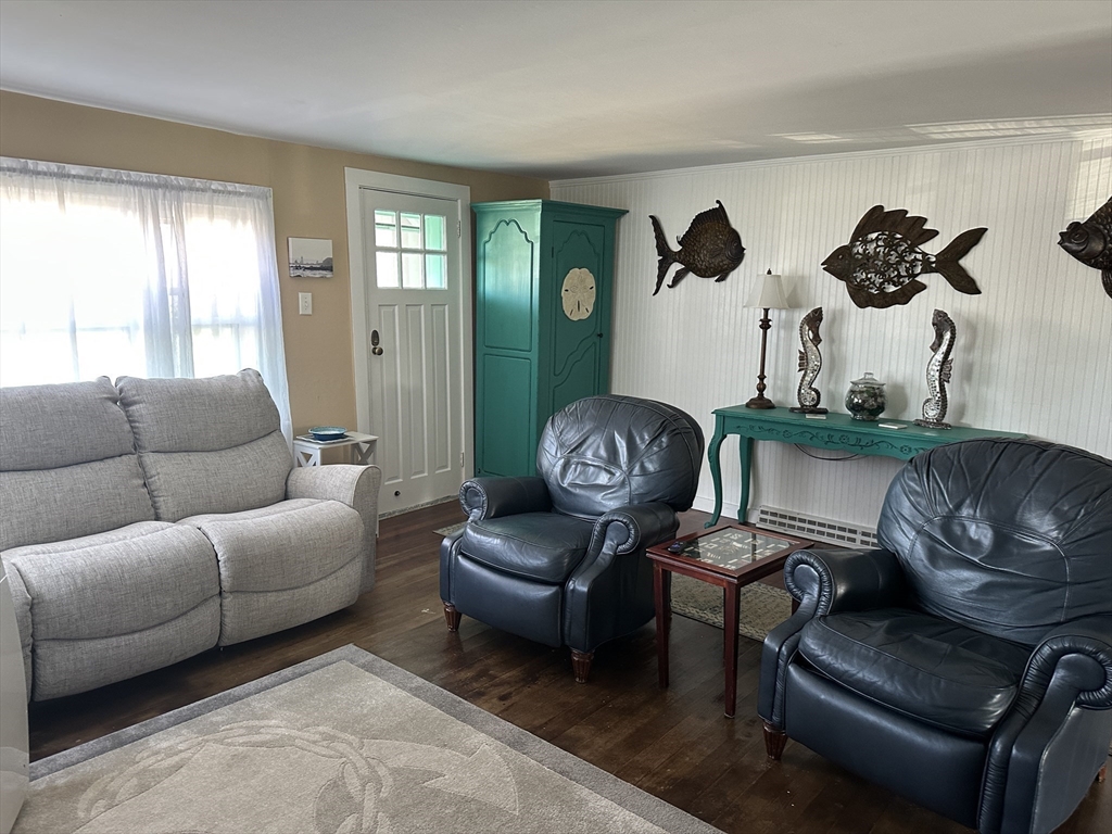 12 Waterman Street, Unit WINTER Mattapoisett, MA 02739 - Photo 2 of 19 a living room with furniture rug and window