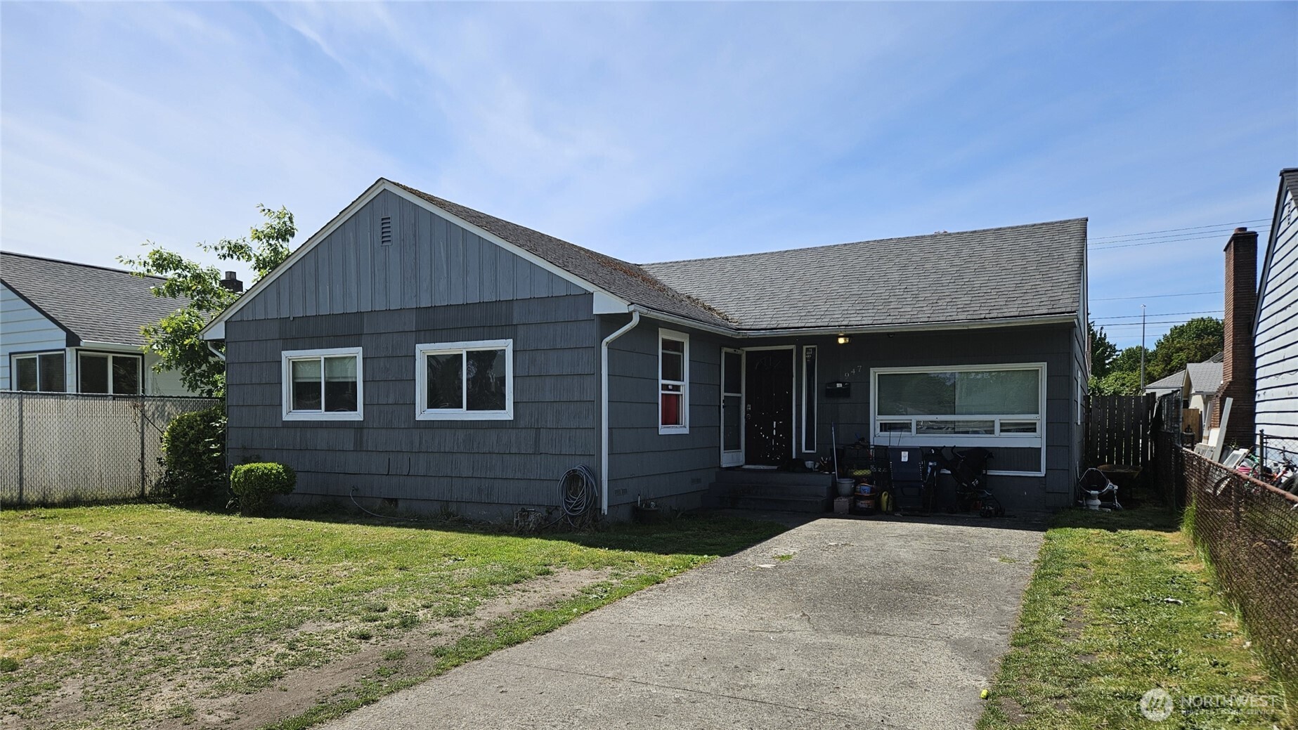947 19th Avenue Longview, WA 98632 - Photo 1 of 12 a front view of a house with a yard and garage