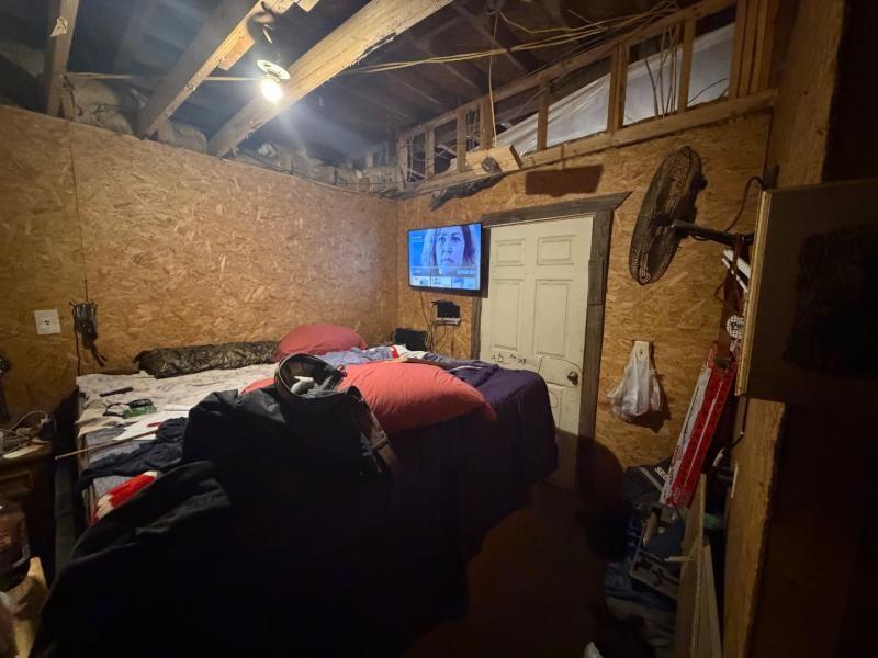 9300 Johns Road Alvarado, TX 76009 - Photo 33 of 40 a bed sitting in a bedroom next to a lamp