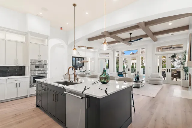 a kitchen with stainless steel appliances kitchen island a large counter space a sink and appliances