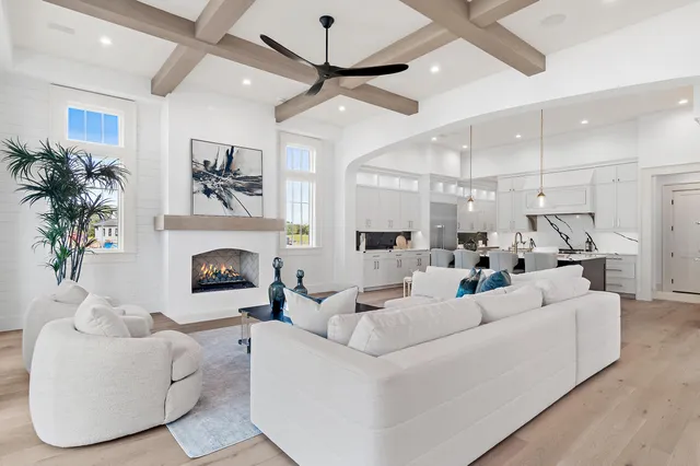 a living room with furniture fireplace and a chandelier